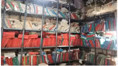 A picture of filed documents on bookshelves
