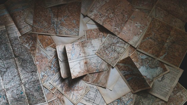 a collection of paper maps