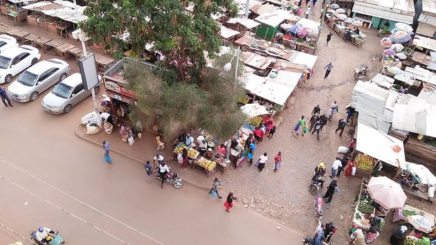 Traders/Small Business women in the temporary makeshift market stalls in Marikiti Market , Kisii county ,Kenya ,East Africa goes about their daily work of selling their fruits and vegetables to earn them a living.