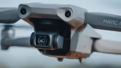 A close-up of a drone with a camera mounted on the front