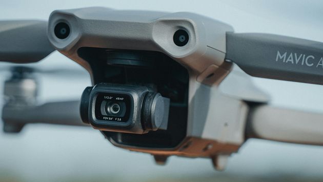 A close-up of a drone with a camera mounted on the front