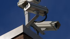 A picture of three CCTV cameras