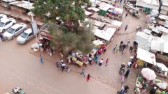 Traders/Small Business women in the temporary makeshift market stalls in Marikiti Market , Kisii county ,Kenya ,East Africa goes about their daily work of selling their fruits and vegetables to earn them a living.