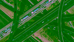 Overhead picture of several busy intersecting highways layered on top one another