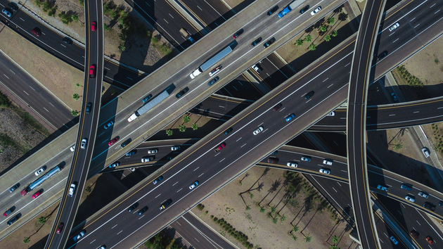 Overhead picture of several busy intersecting highways layered on top one another