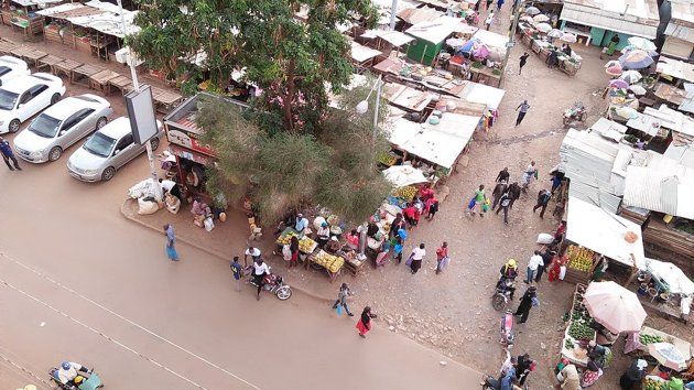 Traders/Small Business women in the temporary makeshift market stalls in Marikiti Market , Kisii county ,Kenya ,East Africa goes about their daily work of selling their fruits and vegetables to earn them a living.